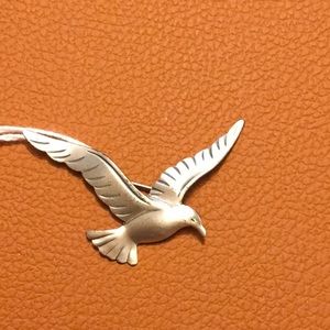 Beau Silver Bird in Flight